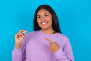 closeup woman pointing to clear aligner