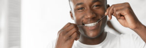 Man flossing gingivitis prevention concept