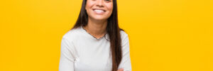 smiling woman on yellow background