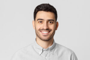 Smiling man on grey background