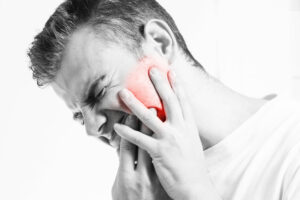 man experiencing severe toothache