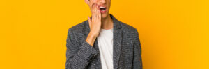 Man having molar pain on yellow background