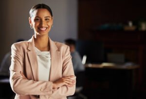 Business woman smiling with arms crossed