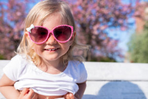 Baby girl smiling in glasses