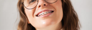 Young beautiful smiley woman with braces